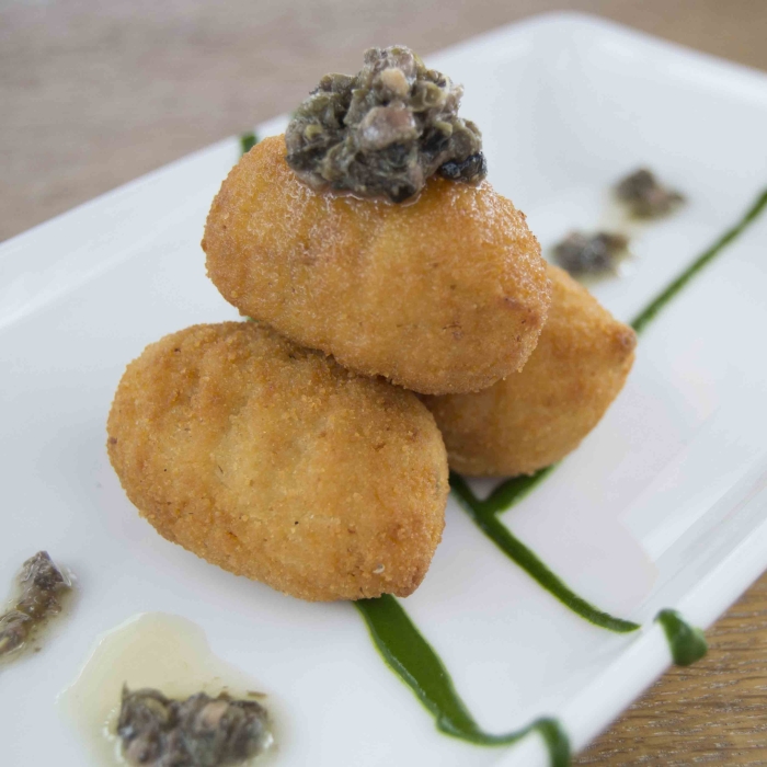 Codfish croquettes with tapenade and spinach cream